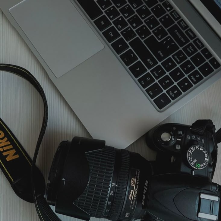 Professional photography setup with camera and laptop running photo editing software 02